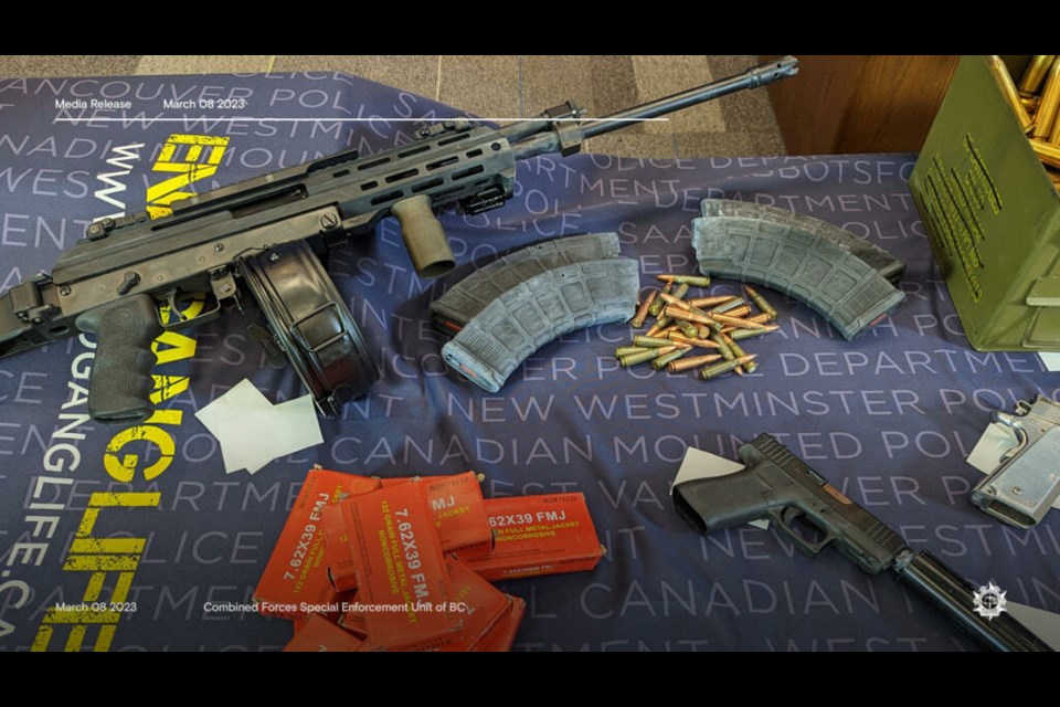 CFSEU-BC display some of the items seized during an ongoing investigation into alleged trafficking of firearms.