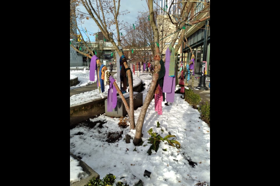 Nearly 400 handmade scarves, toques, cowls and headbands were dispersed as part of Chase the Chill. Many of the items were given out in Hyack Square on Saturday.