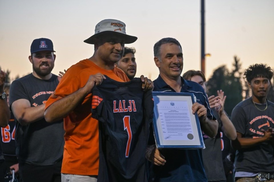 Mayor Patrick Johnstone, right, presented a Farhan Lalji Day proclamation to Lalji  at Homecoming 2023.