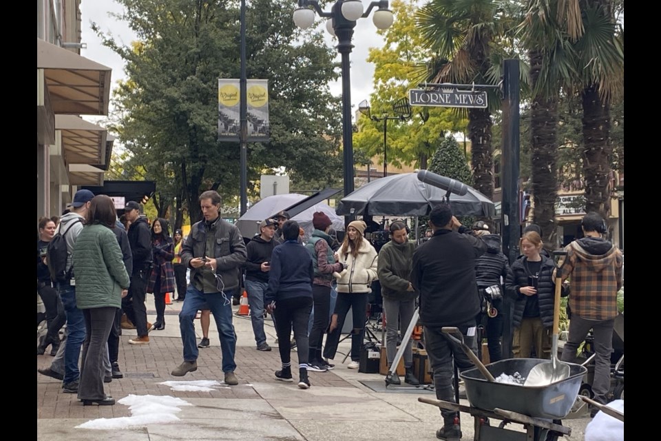 Sealed With a List director Lucie Guest, in white jacket, talks to actor Katie Findlay, while filming in New West on Oct. 4.