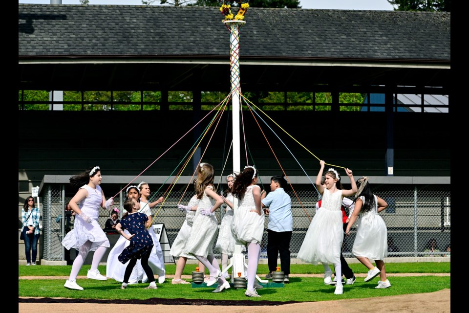 This year's May Day event included traditional maypole dances.
