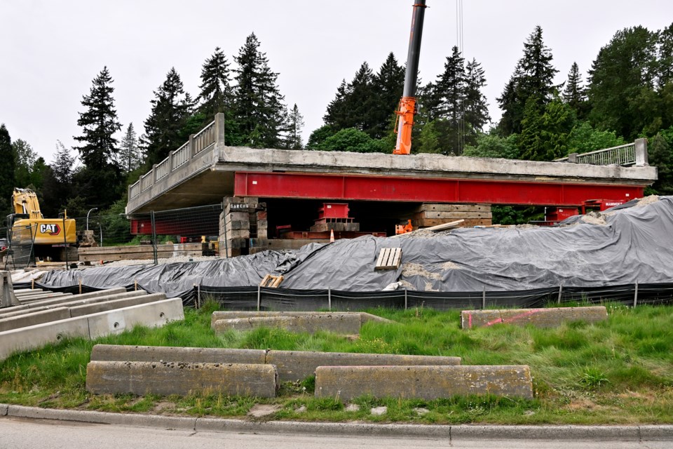 A self-propelling modular transporter had issues during its first attempt at moving the Royal Overpass in April, but got the job done in May.