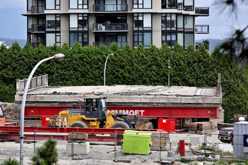 Old and new: A “self-propelling modular transporter” was used to move the old and new 600-ton overpasses on Royal Avenue.