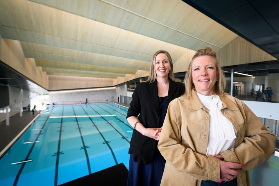 Corrine Garrett and Tobi May, from left, are among the city staff keen to seen the city's new pools open to the public on May 14. 