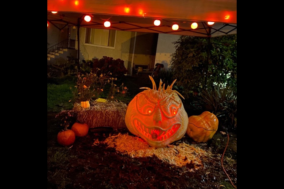 Goliath, a 560-pound pumpkin, awaits visitors at 117 East Durham St. in New West before he ends up in the compost pile.