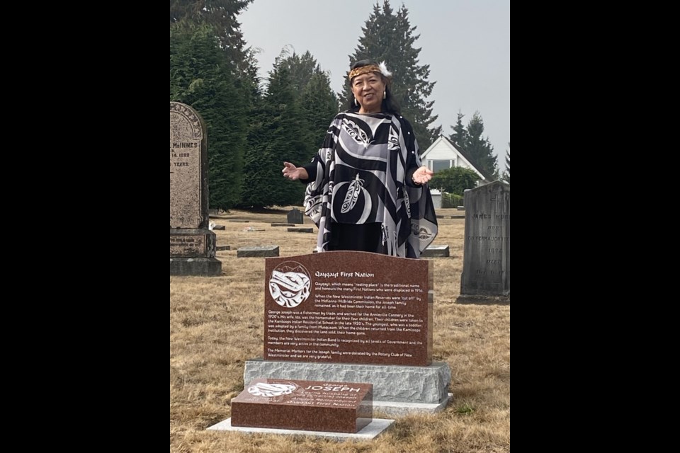 Qayqayt Chief Rhonda Larrabee welcomes people to the unveiling of new grave markers of four of her ancestors who had been buried in unmarked graves for more than a hundred years.