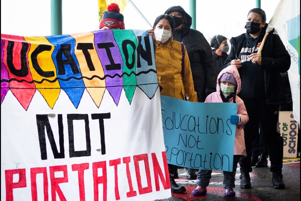 Dozens of people rallied in New West on Dec. 18 in support of sanctuary school policies and sanctuary zones around schools.