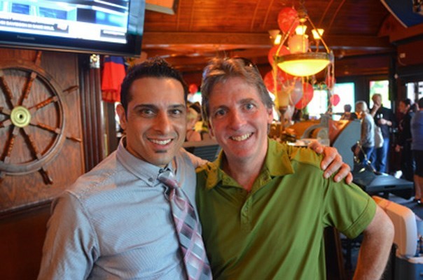 Peter Saran, left, shown with former Record photographer Larry Wright at the pub's anniversary party in 2012, is thrilled to be reopening the local watering hole.