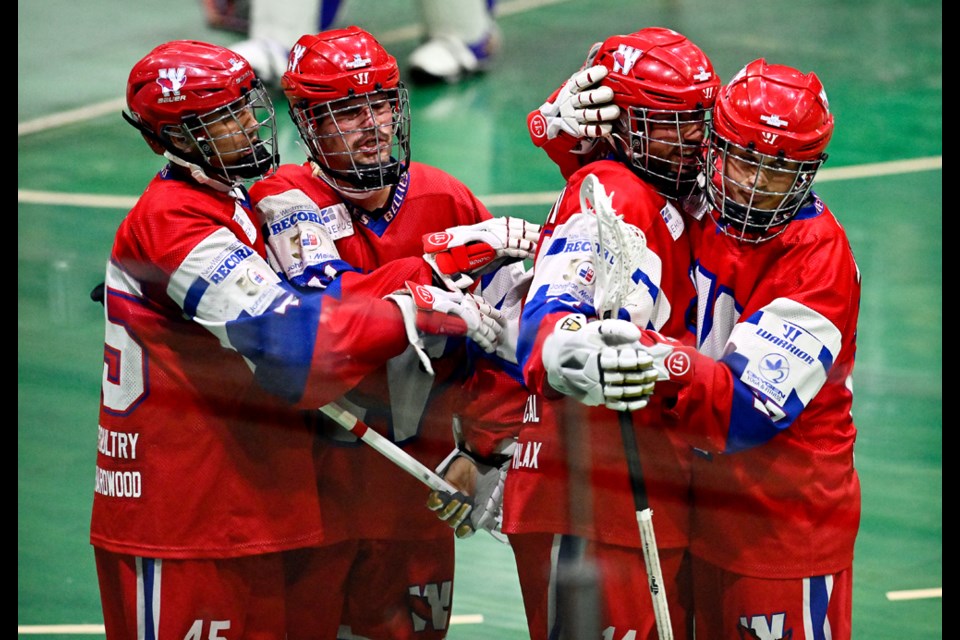 The New Westminster Salmonbellies celebrate a goal in Game 1 of the WLA finals on Wednesday night at Queen's Park Arena.