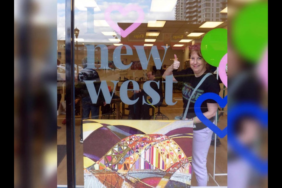 Artist Janet Kvammen with her work in the I Heart New West community space at Columbia Square.