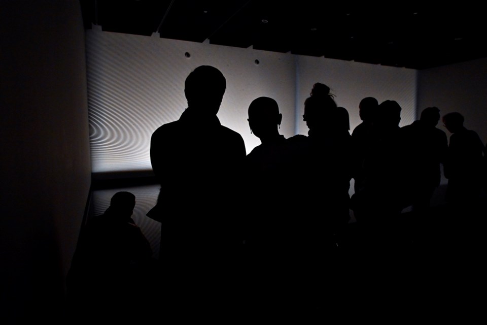 Visitors take in Finnbogi Pétursson's Infra/Supra at the opening reception for the new exhibition aBIOTIC at the New Media Gallery at Anvil Centre.