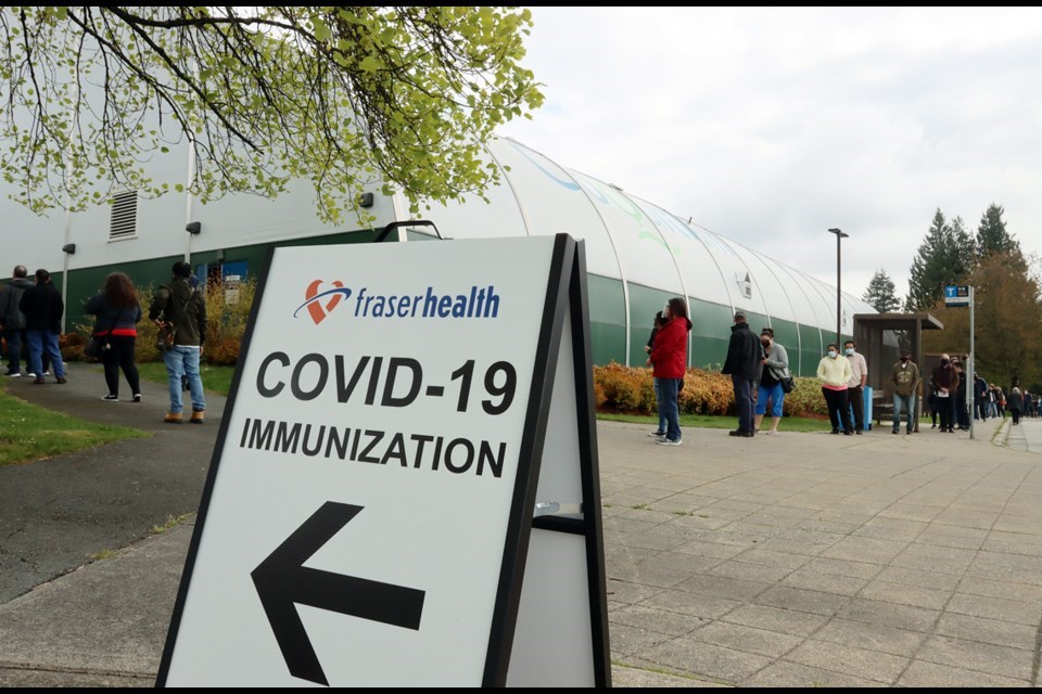 People lined up to get vaccinated at a pop-up clinic.