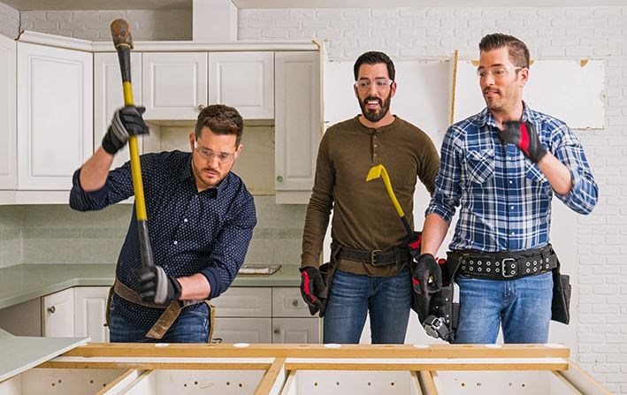 Michael Bublé with the Property Brothers, Drew and Jonathan Scott, during an episode of Celebrity IOU set in Burnaby.