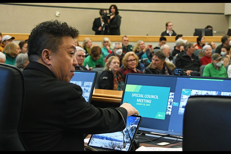 Coun. James Wang prepares to vote at a special council meeting regarding a compost facility proposed for Fraser Foreshore Park.