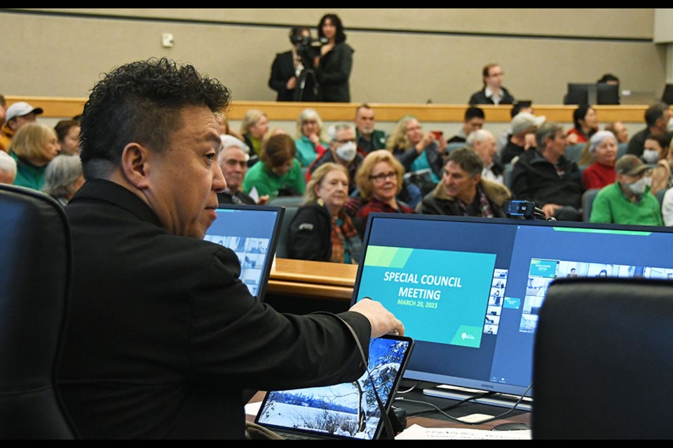 Coun. James Wang prepares to vote at a special council meeting regarding a compost facility proposed for Fraser Foreshore Park.