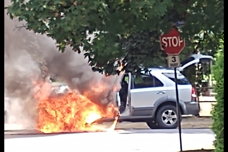 A vehicle on fire near Queen's Park.