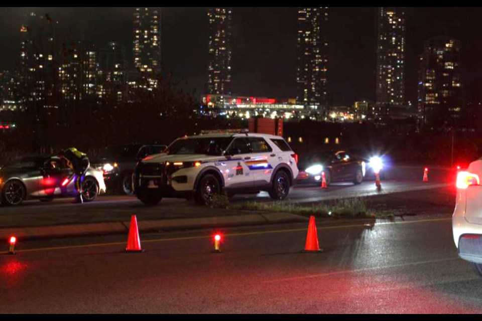 RCMP officers in Burnaby pull over drivers in a road check.