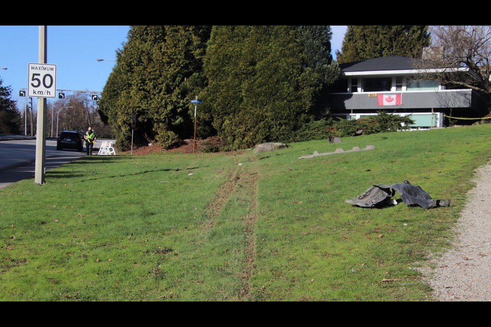 Tire marks on the grass leading up to a New Westminster home. The vehicle then launched into the backyard.