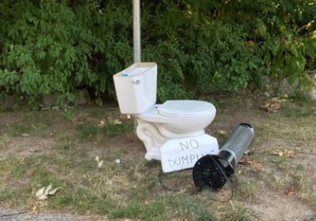 A 'no dumping' sign and some waste on Horne Street in Burnaby.