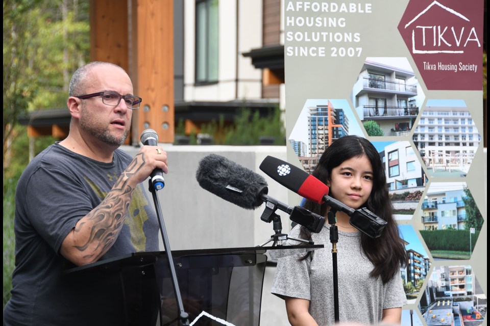 New Susana Cogan Place resident Aish Roitman and his daughter Maya speak at a news conference in Burnaby.