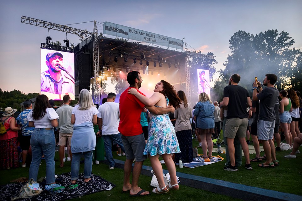 Colleen Campbell of Burnaby and Kevin Alves of Vancouver dance along to the Fleet Foxes at the Burnaby Blues and Roots festival at Deer Lake park on Aug. 12, 2023. Photo: Jennifer Gauthier