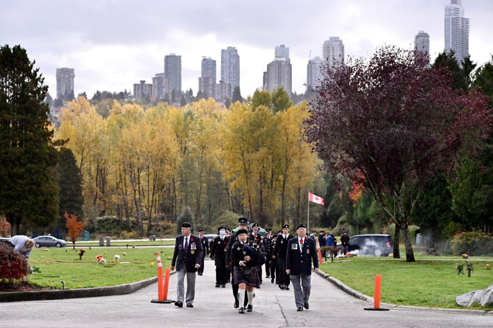 A piper leads the entire contingent to WW2 SJA veteran, Dr. Po Tin Chak’s grave.