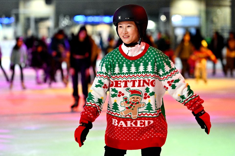 Connie Zou skates in a Ugly Christmas Sweater.