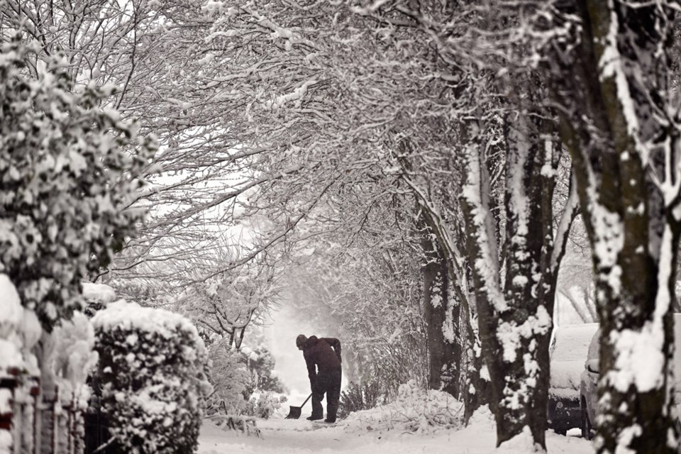 Residents in Burnaby Heights dig out after a snowstorm on Feb. 2, 2025.