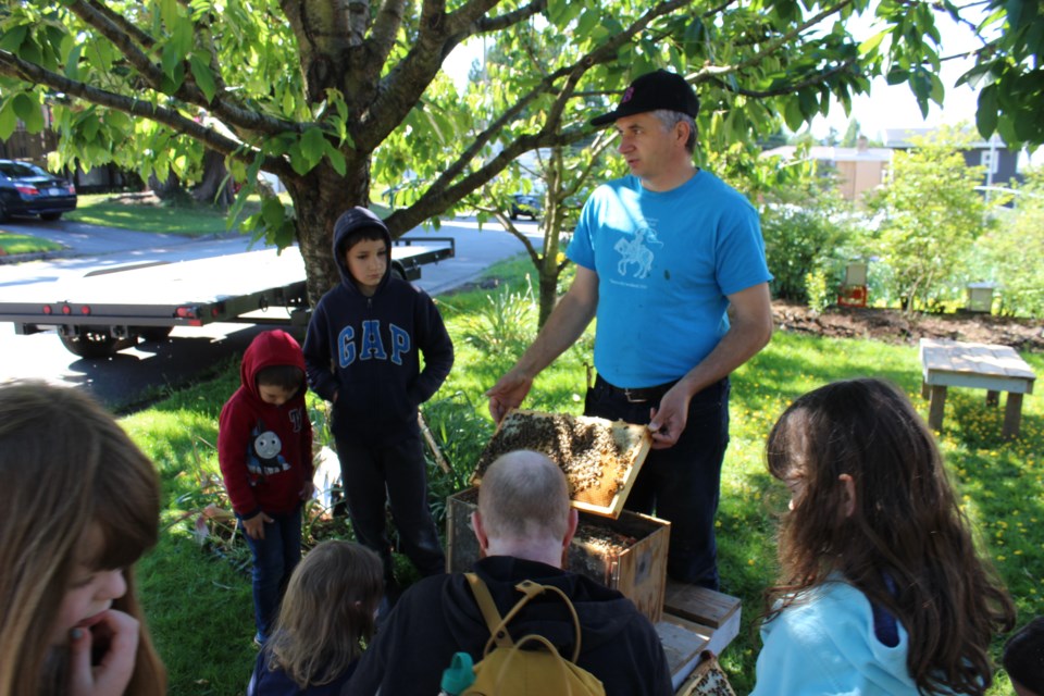 Local students taught about bees and hives.