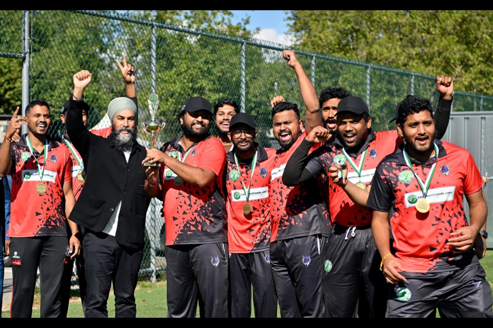 Jagmeet Singh presents the Vancouver Vikings (of Burnaby) with a trophy after they defeated the Okanagan Hawks Cricket Club in the final of the LMS BC Blasters tournament at Burnaby Lake.
