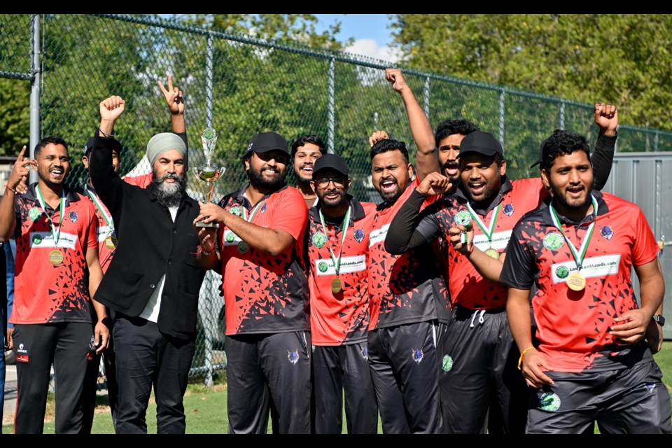 Jagmeet Singh presents the Vancouver Vikings (of Burnaby) with a trophy after they defeated the Okanagan Hawks Cricket Club in the final of the LMS BC Blasters tournament at Burnaby Lake.
