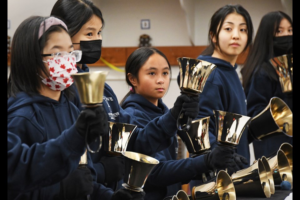 Members of the Burnaby school district handbell choir, Sound Wave, rehearse at Inman Elementary School Monday.