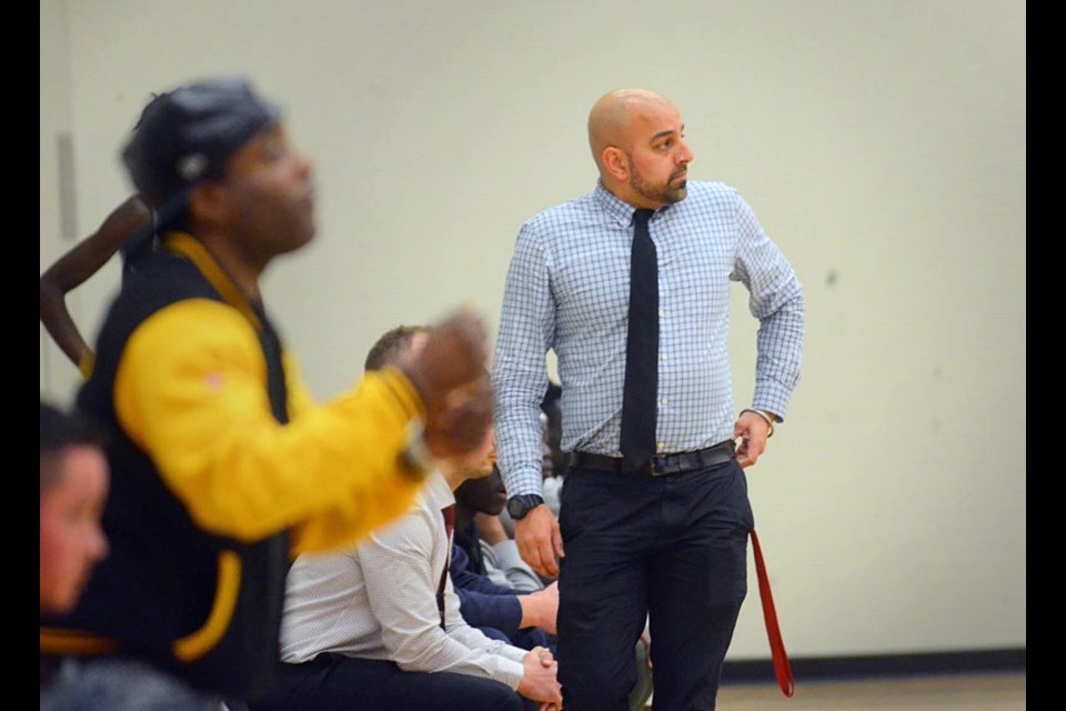 Byrne Creek coach Bal Dhillon walks the sideline at a past senior boys basketball game.