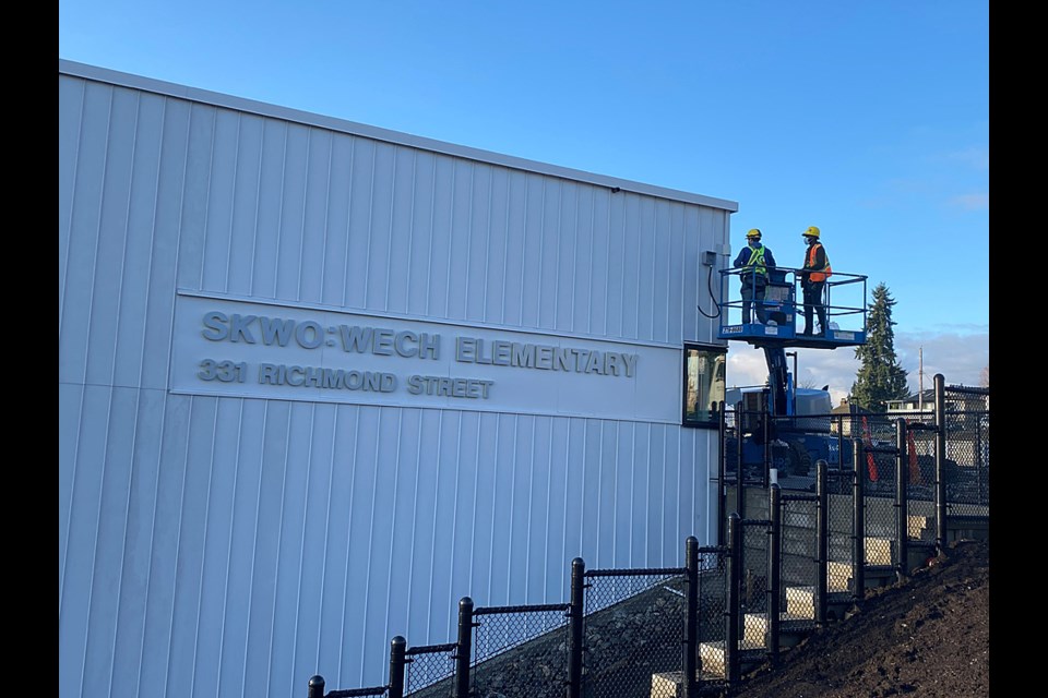 Workers are completing the final details at the new Skwo:wech Elementary School, which is ready for a March break move-in.