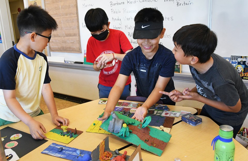 Gyuwon Lee, Jobe Chai, Nixon Yukawa and Alex Autiero set up an elaborate game they created out of plasticine during a summer school art class at Kitchener Elementary School this year. 