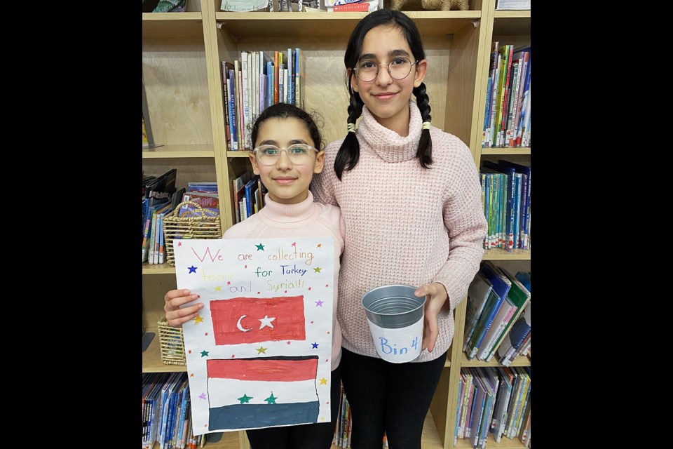 Alisa and Alinda Tunc, who came to Canada from Turkey two years  ago, spearheaded a fundraiser at their school for earthquake relief in Turkey,