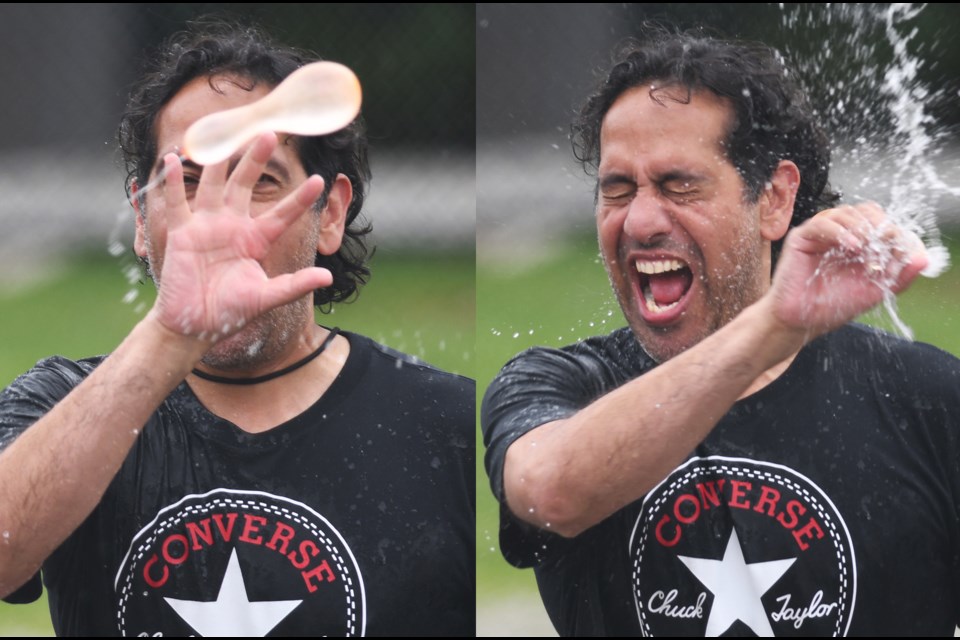 Seaforth Elementary School Grade 7 teacher Rob Aujla makes a splash duringthe finale of a fundraiser for Ukraine last Friday.