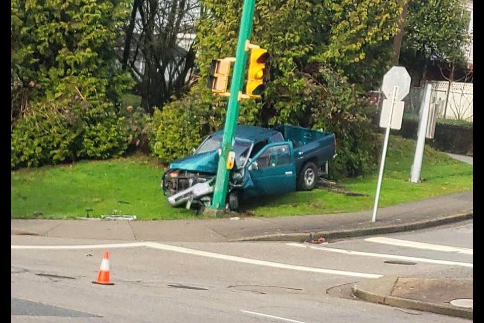 Commenters on Reddit were puzzled by the angle of this pickup truck, which ran into an electrical kiosk and traffic light in Burnaby Saturday.