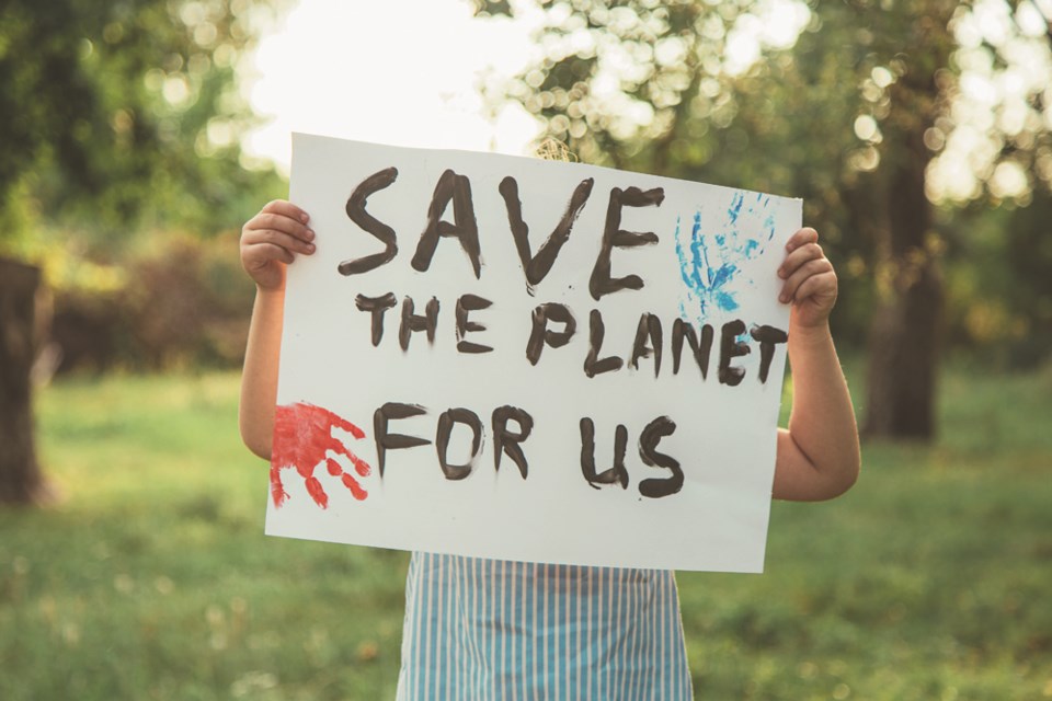 childwithsavetheplanetsign