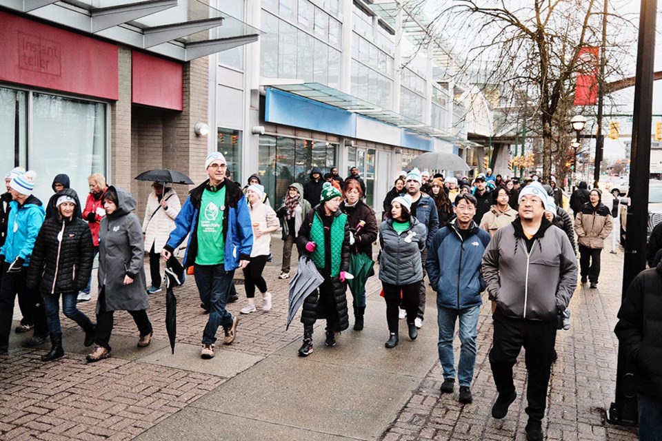 Hundreds of Burnaby residents walked along Kingsway through Metrotown for Coldest Night of the Year 2024, raising awareness on homelessness.