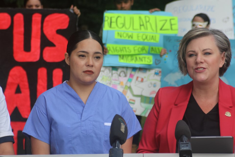 Claudia Zamorano, left, and Hospital Employees' Union president Barb Nederpel speak at a press conference in Sapperton Park Aug. 3. The HEU is urging the federal government to allow Zamorano, a health-care worker, and her family to stay in Canada  instead of deporting them to Mexico.