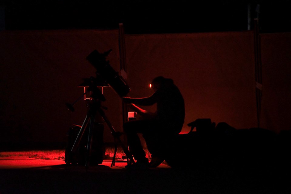 Amateur self-taught astrophotographer and Burnaby resident Miles van Yperen sets up his telescope and photography equipment.
