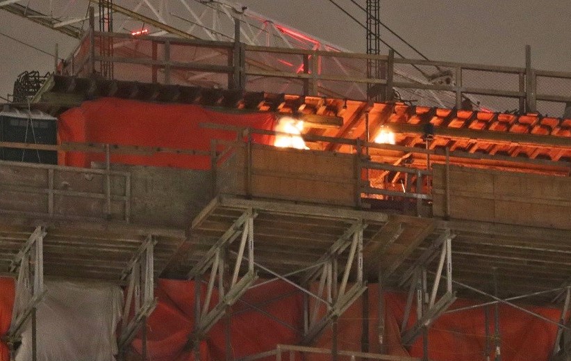 Construction tarps burn on the 43rd floor of a Brentwood highrise under construction Tuesday night.
