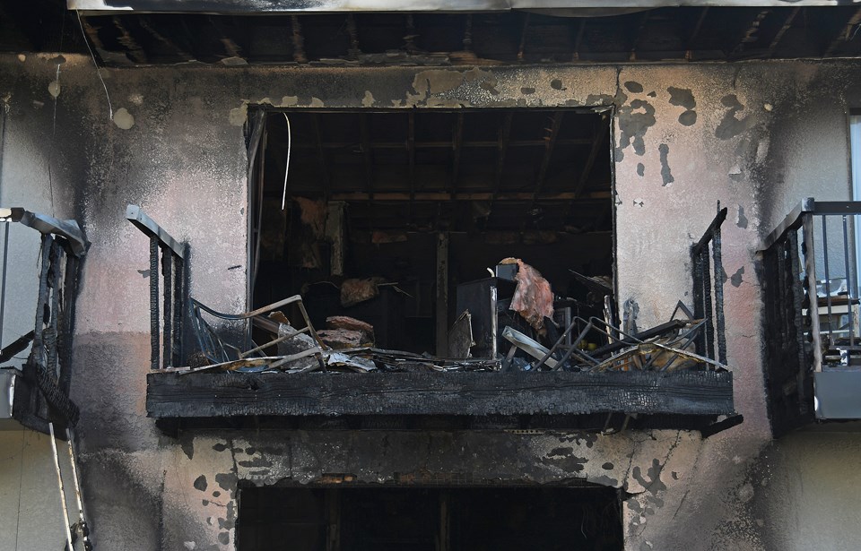 Fire 'totally gutted' two suites in a lowrise apartment building on Holdom Avenue Thursday morning. 