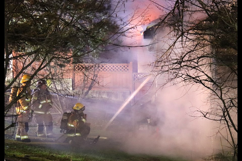Burnaby firefighters battle a house fire in the 3600 block of Douglas Road early Wednesday morning.