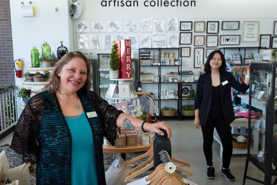 Sales associates Erica Friberg, left, and Victoria Hong at Found boutique, a social enterprise that raises money for the Union Gospel Mission's outreach programs. Jennifer Gauthier/The Record