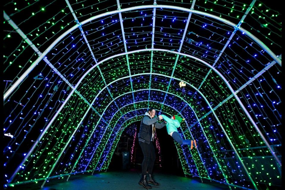 Samantha and 1.5-year-old Marigold Johnstone take in the Shine Bright display in Hyack Square.