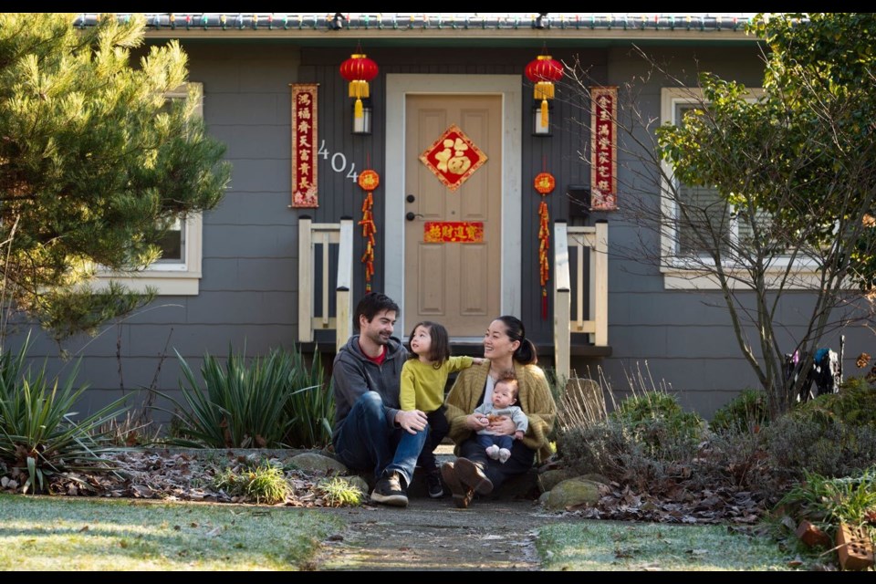 Elaine Su,  shown here with husband Rob, and kids Ellis and Margo, helped rally her neighbourhood to decorate for the Lunar New Year in January 2021.