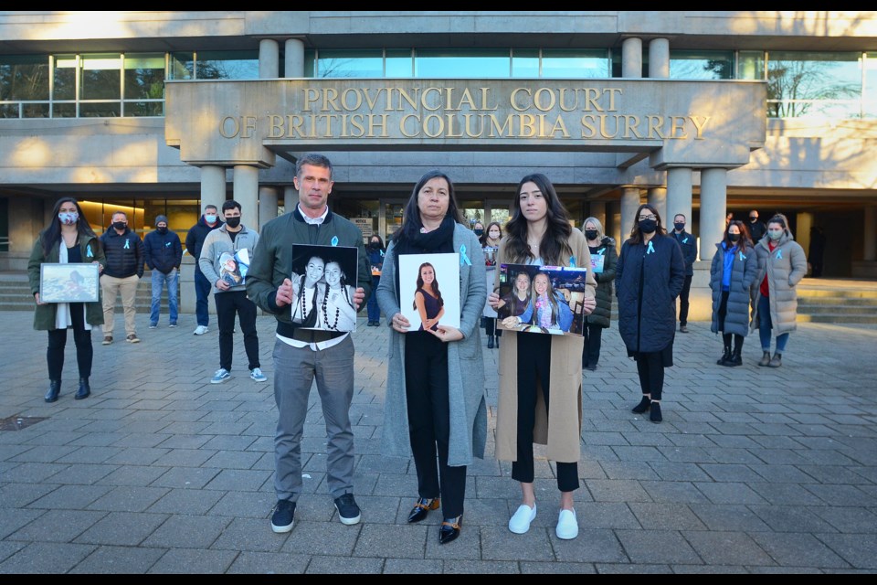 Tony, Bridget and Erica Malcom stand with supporters outside Surrey provincial court Monday after a sentencing hearing for 45-year-old Chao Chen, the man responsible for the death of 19-year-old Olivia Malcom in June 2018.