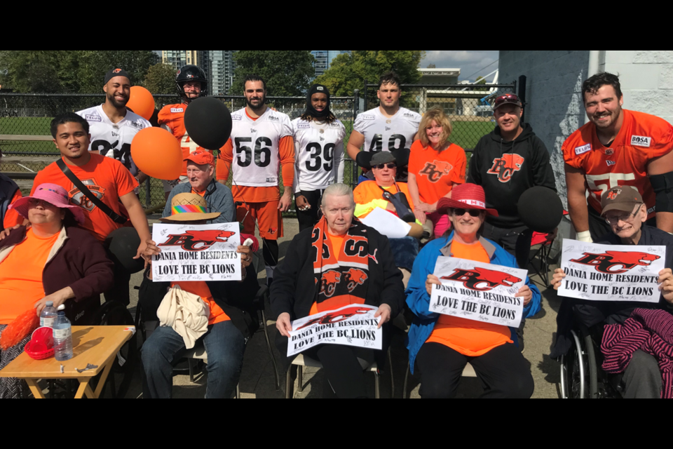 Dania Home residents meet with BC Lions players and coaches.